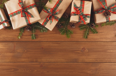 Gift Boxes on Wooden Table With Pine Branches for Holiday Celebration or Special Occasion
