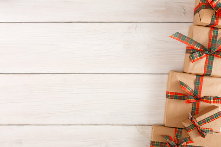 Gift Boxes Stacked in a Cozy Setting for a Festive Celebration and Special Occasionsの写真素材