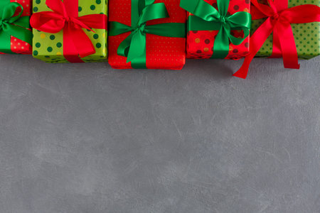 Colorful Gift Boxes Arranged in a Collage on a Grey Surface for a Festive Occasion