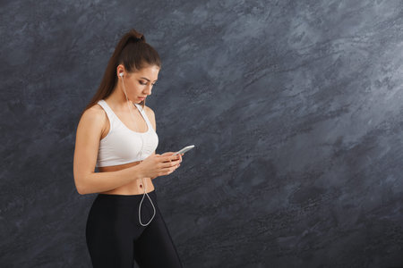 Collage of Young Woman Listening to Music on Phone While Standing Against a Wall of Textured Design