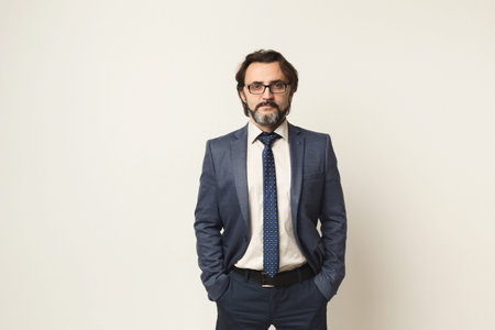 Business Professional Stands Confidently in a Studio Setting for a Formal Portrait