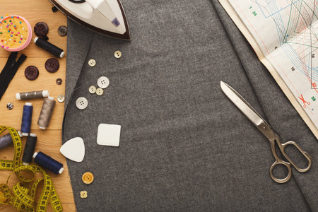 Collage of Sewing Tools and Materials on a Wooden Table