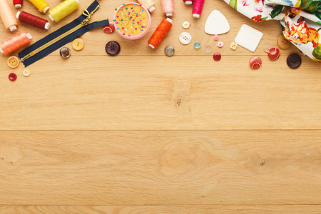 Crafting Ideas Come to Life With Colorful Threads, Buttons, and Accessories on a Wooden Table