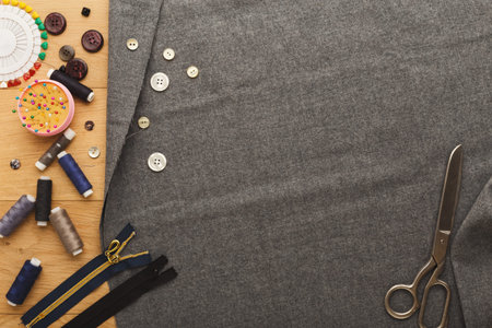 Collage of Sewing Materials and Fabric on a Wooden Table for Crafting and Design Projects