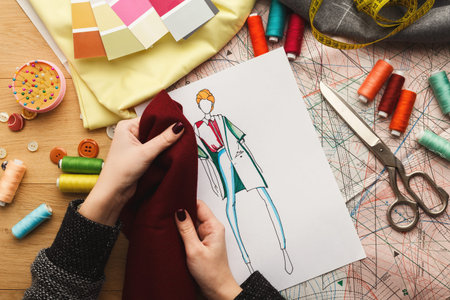 Crafting a Fashion Design With Fabric Swatches and Sketches Showing Creative Process in Action