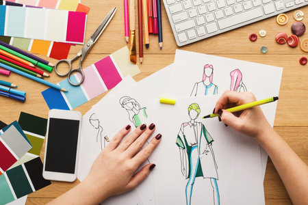 Creative Process in Design Workshop With Sketches, Tools, and Colors on Table