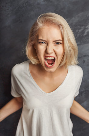Woman Expressing Anger in a Set Collage of Emotions During a Photo Session
