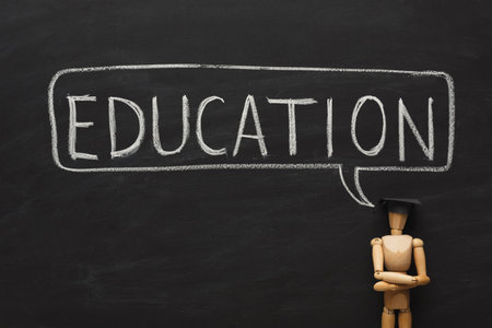 Collage of Education Themes With Wooden Figure and Chalkboard Background During a Learning Sessionの写真素材