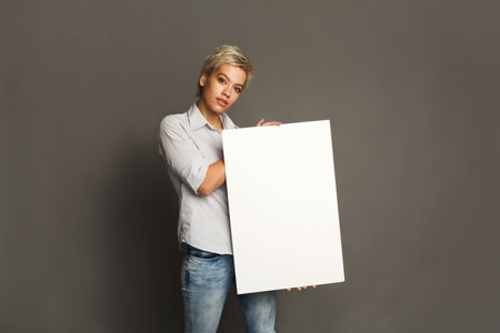 Collage of a Person Holding a Blank Canvas in a Studio Setting