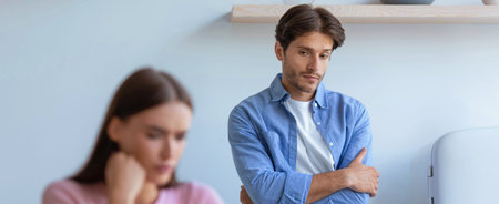 Couple Sits in a Room With a Conflict, Showing Emotions and Body Language