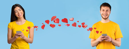 Happy Guy Using Smartphone in Studio Setting With Blue Background and Heart Theme