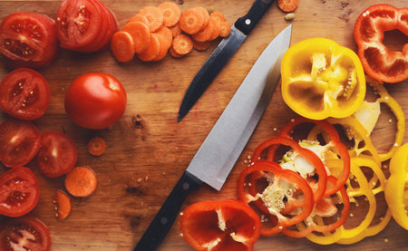 Colorful Vegetable Collage on a Wooden Cutting Board With a Knife
