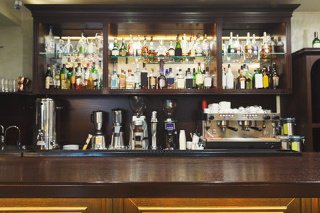 Collection of Drinks and Bar Tools in a Bar Setting With a Detailed Display