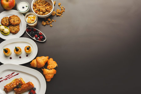 Breakfast Collection With Various Foods Placed on a Dark Surfaceの写真素材