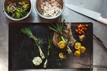 Dinner Preparation With Fresh Ingredients on a Metal Surface in a Kitchen Setting