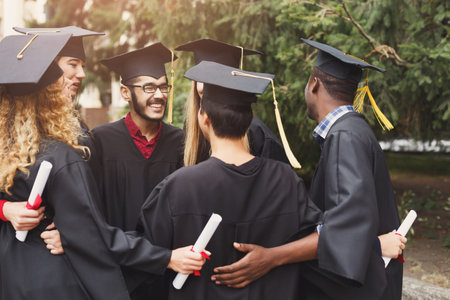 Group of Graduates Celebrate Their Achievement Together in a Friendly Gathering Outside