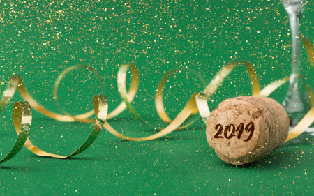 Collage of New Year Celebration Items With the Year 2019 Displayed on a Cork