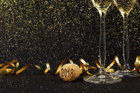 Celebration for New Year With Champagne Glasses and Confetti on Black Background