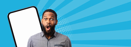 Man Shows Surprise Next to a Large Blank Phone Screen in a Colorful Setting for a Digital Collageの写真素材
