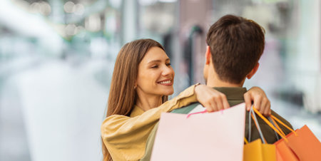 Couple Enjoying Shopping Together in a Mall During Afternoon Hoursの写真素材