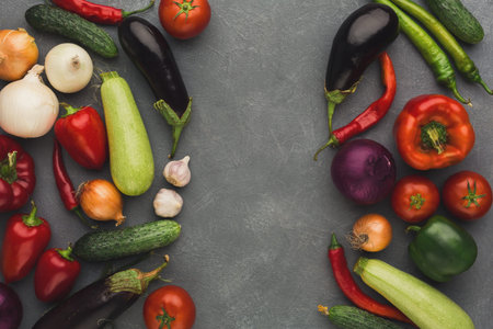 Collection of Fresh Vegetables Arranged on a Gray Background for a Cooking Project or Recipe Idea