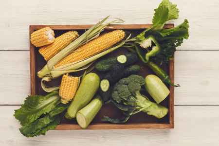 Mosaic of Fresh Vegetables Arranged on a Wooden Tray in the Kitchen