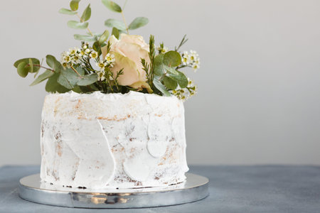 Mosaic Collection of a Cake With Flowers and Greenery on a Simple Stand