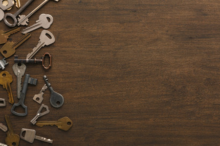 Collection of Various Keys Arranged on Wooden Surface for a Collage Display