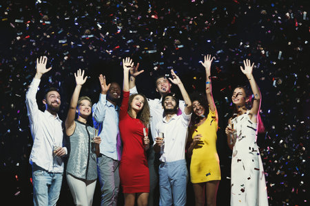 Celebration of Joy at a Party With Friends in a Lively Setting at Night
