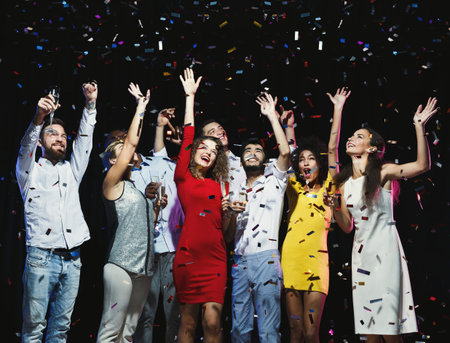 Celebration With Friends in a Confetti-Filled Moment at a Lively Party Gathering