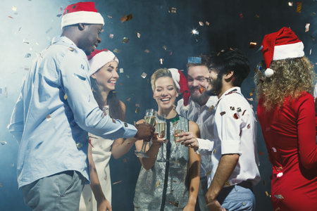Celebration With Friends at a Gathering During the Holiday Season With Drinks and Confetti