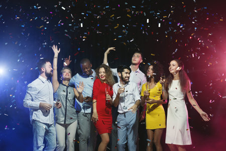 Group of Friends Enjoy Celebration With Confetti and Drinks During a Party Night in a Collage