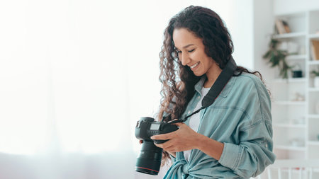 Woman Checking Camera Settings Indoors With Soft Light in a Bright Room