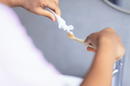 Brushing Teeth With Toothpaste at a Bathroom Sink During Morning Routine