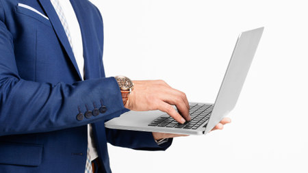 Unrecognizable Business Man Using His Laptop Computer. Panorama, Cropped