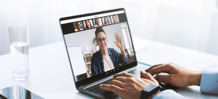 Businessman and Healthcare Worker Engages With Clients on Video Call From Modern Office Space