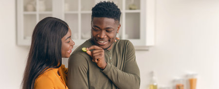 Loving african american couple preparing food in cozy kitchen together