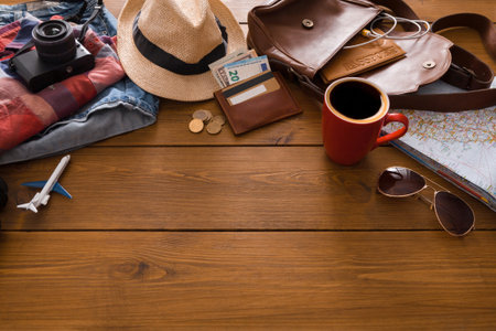 Preparing for a Trip With Essentials on a Wooden Table With Travel Items Around