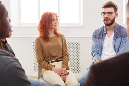 Group Discussion Taking Place in a Bright Room With Diverse Participants Sharing Thoughts