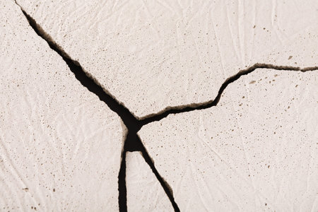 Cracked Surface of Dry Earth Showing Texture and Fissures in Natural Environment During Daylight