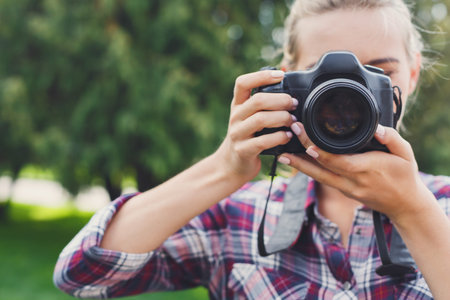 Capturing Moments in a Park While Enjoying a Sunny Day Outdoors With a Camera