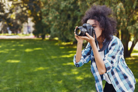 Collection of a Person Taking Pictures in a Green Park Setting During Daylight Hoursの写真素材