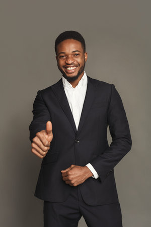 Man in Suit Smiles and Shows Thumbs up in Collage Set of Professional Images and Portraitsの写真素材