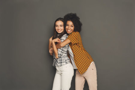 Collage of Two Friends Smiling and Posing Together in a Studio Setting
