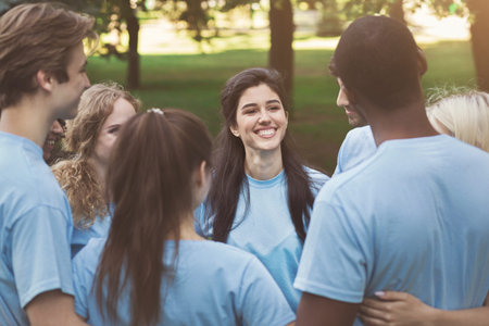 Meeting of young volunteers team in park