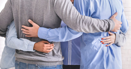 Group of people embracing in circle and bonding to each other