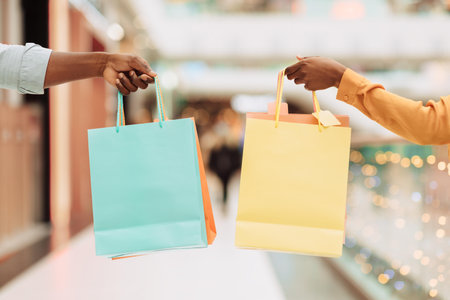 Hands With Colorful Shopping Bags, Engaging In Retail Activity, Diverse Gender And Ethnic Representation