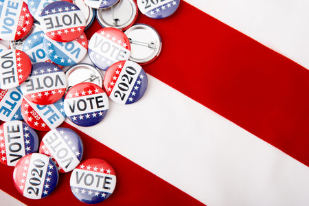 Elections 2020 patriotic pins on US flag background