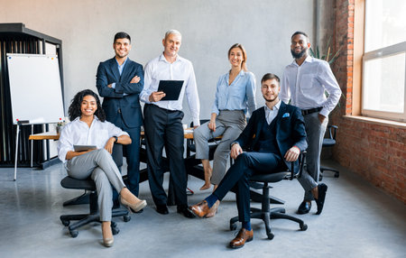 Coworkers Smiling To Camera Posing In Modern Office