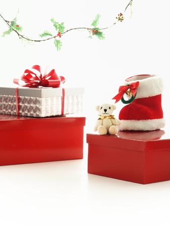 teddy bear, christmas boot, and presentの写真素材